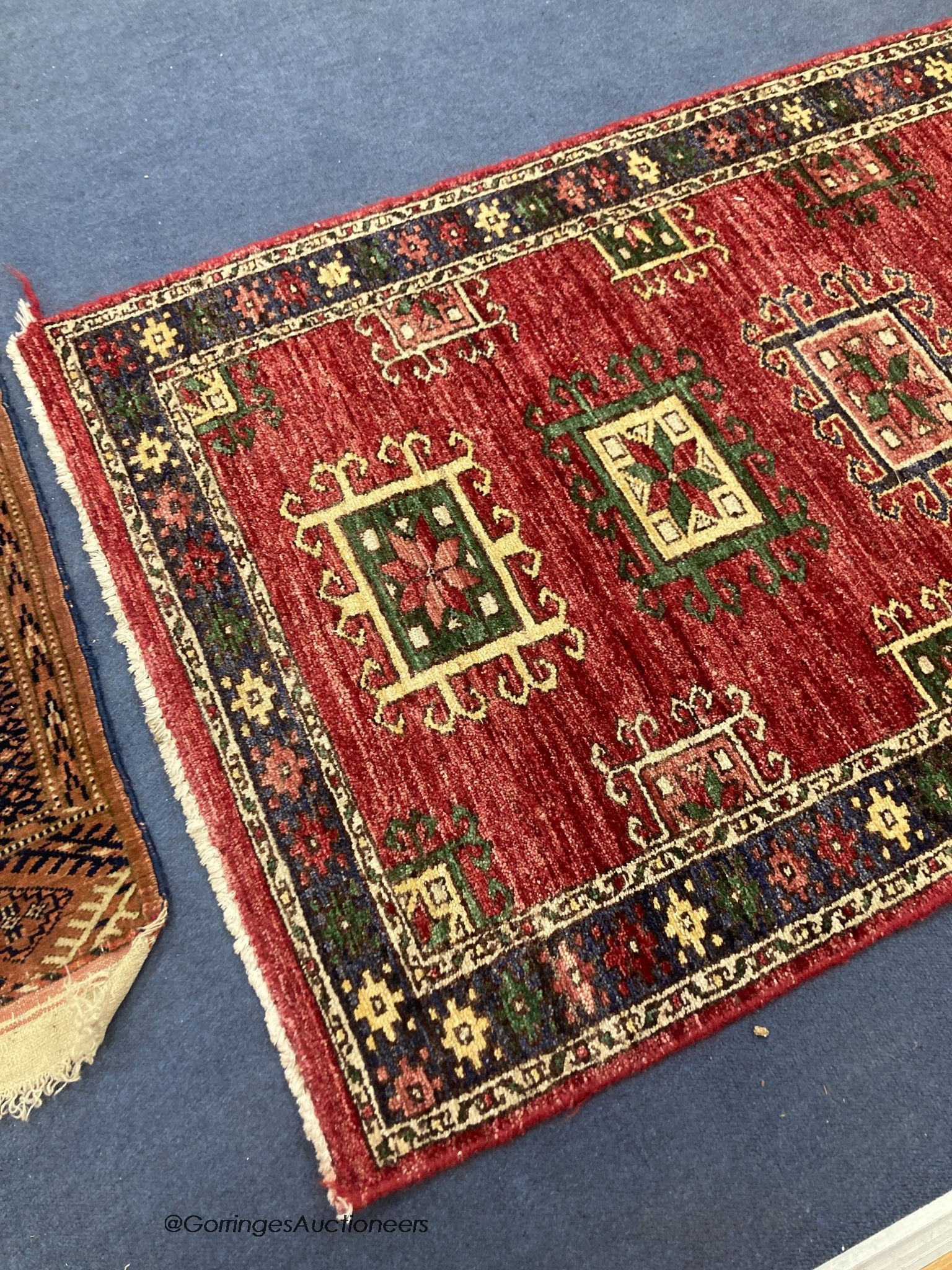A Caucasian style red ground runner, 240 x 80cm